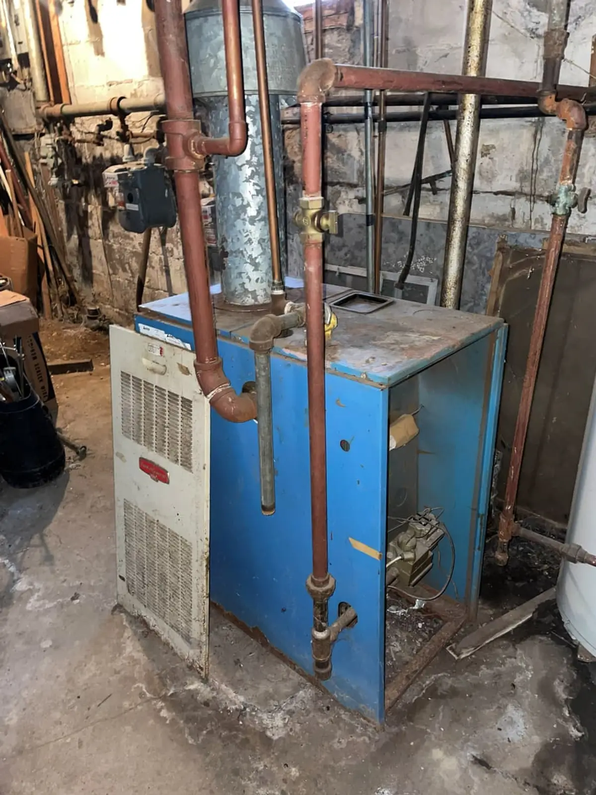 Selling a parent’s house after a move to care in Brentwood: old boiler and tangled copper piping in the basement