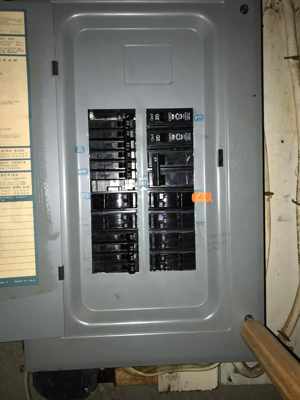 Selling a house with a reverse mortgage in Brentwood: old electrical panel in an unfinished basement