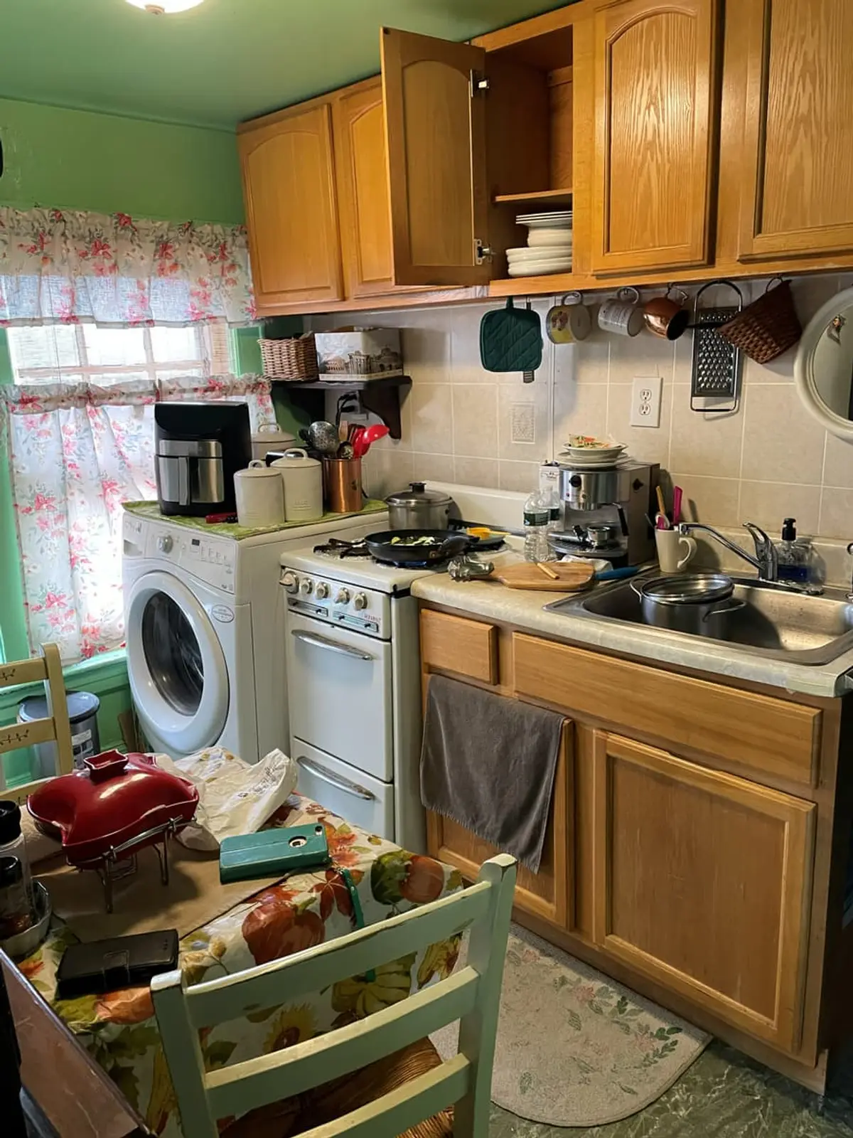 Selling a house during a divorce in Brentwood: small kitchen with oak cabinets and crowded counters